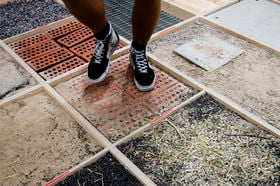 feet stepping on surfaces with sand, tile, gravel and hay to create different sounds