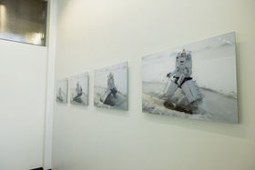 Four photopraphic artworks of an icebreaker icefishing, in K1 building.