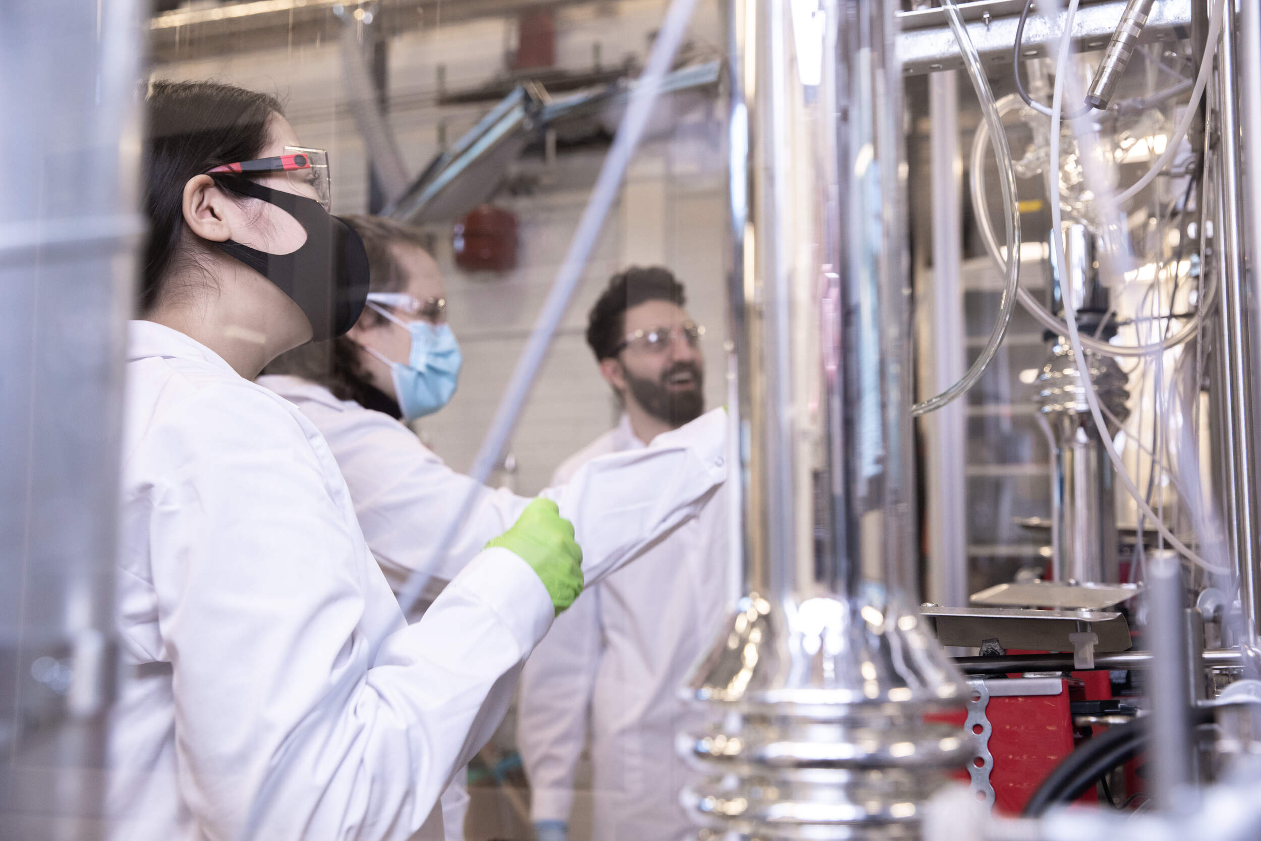 Three scientists working in a laboratory