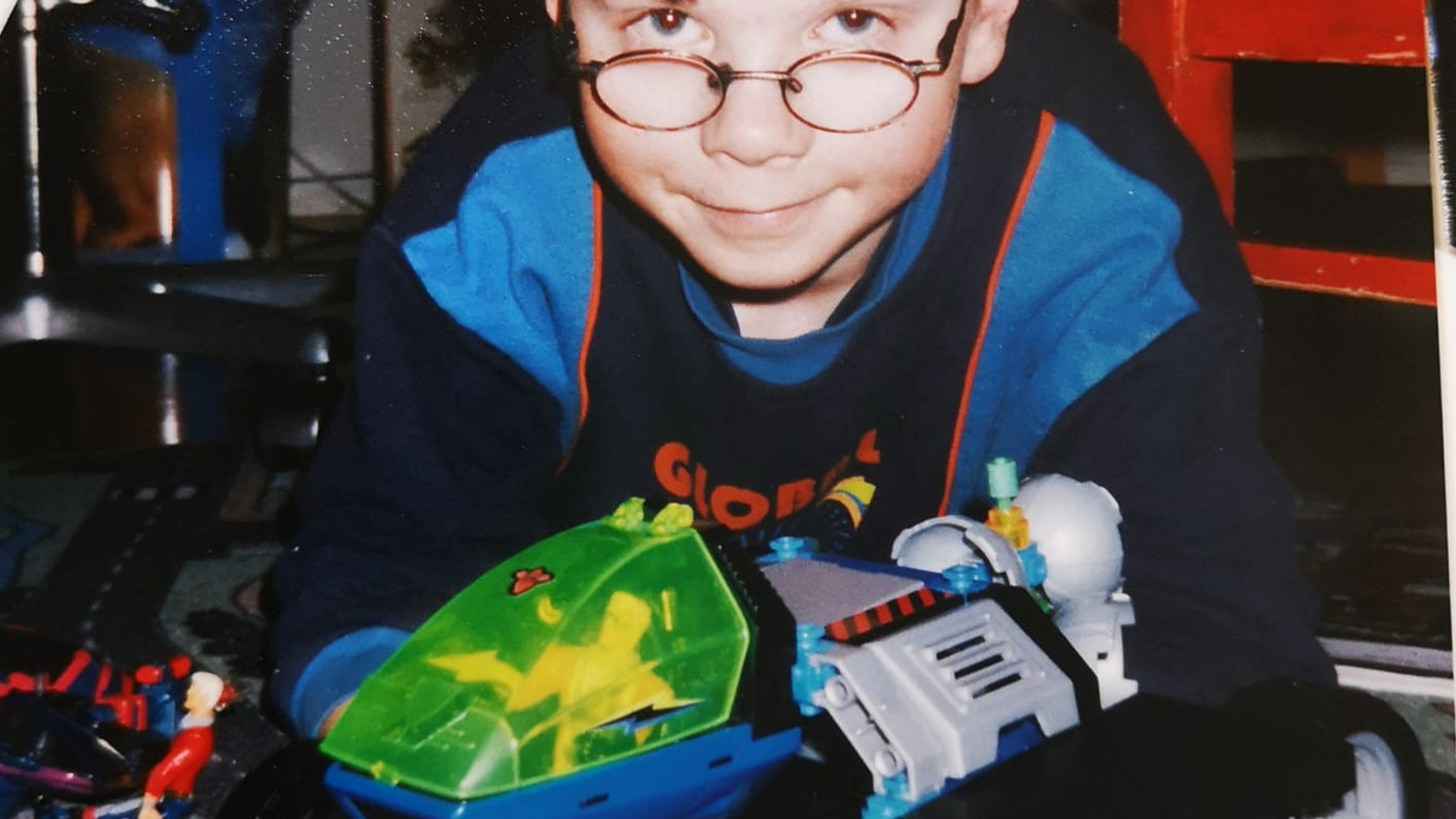 Sakari as a child with toys