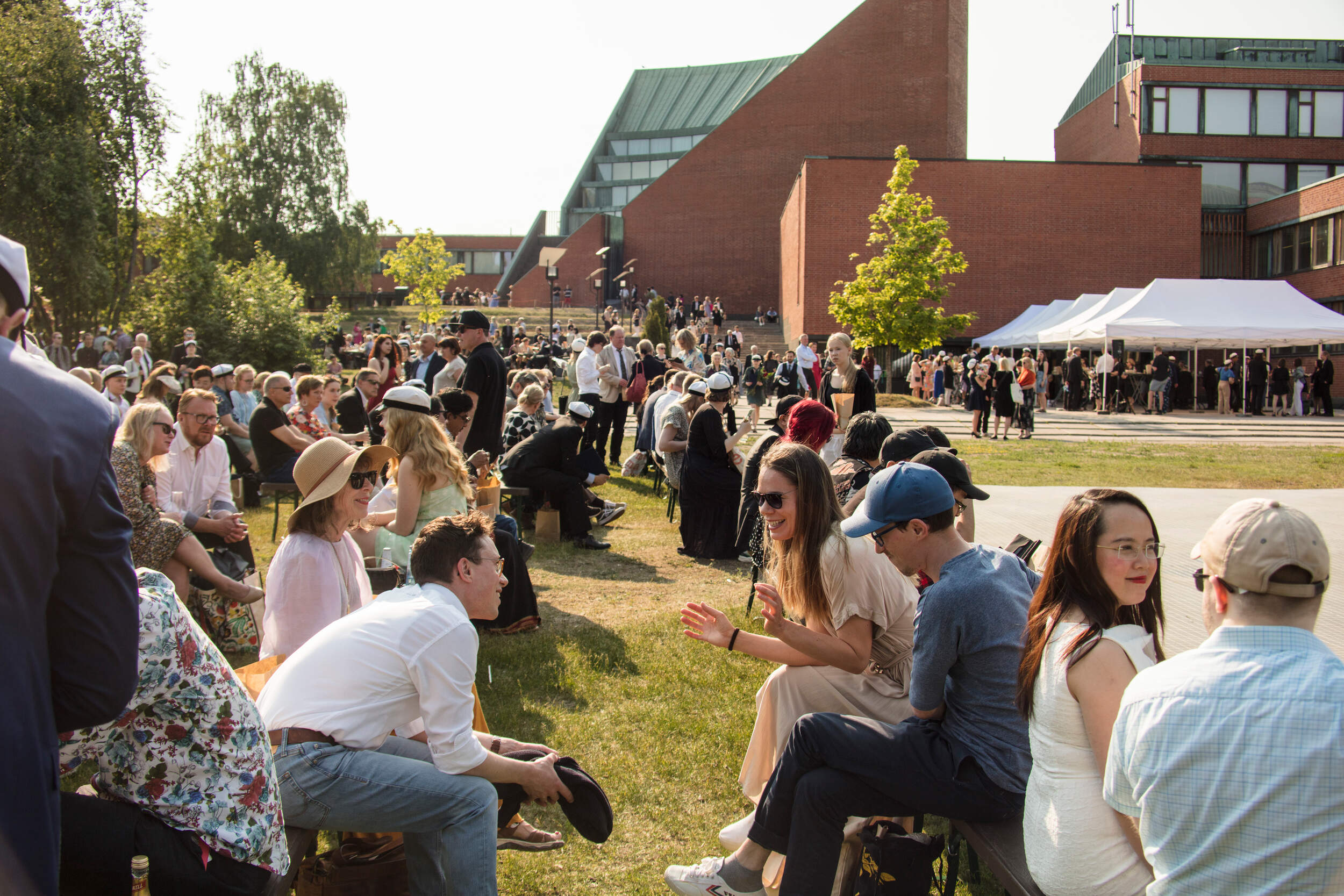 Joyful guests of Graduation Party in Alvar Aalto park