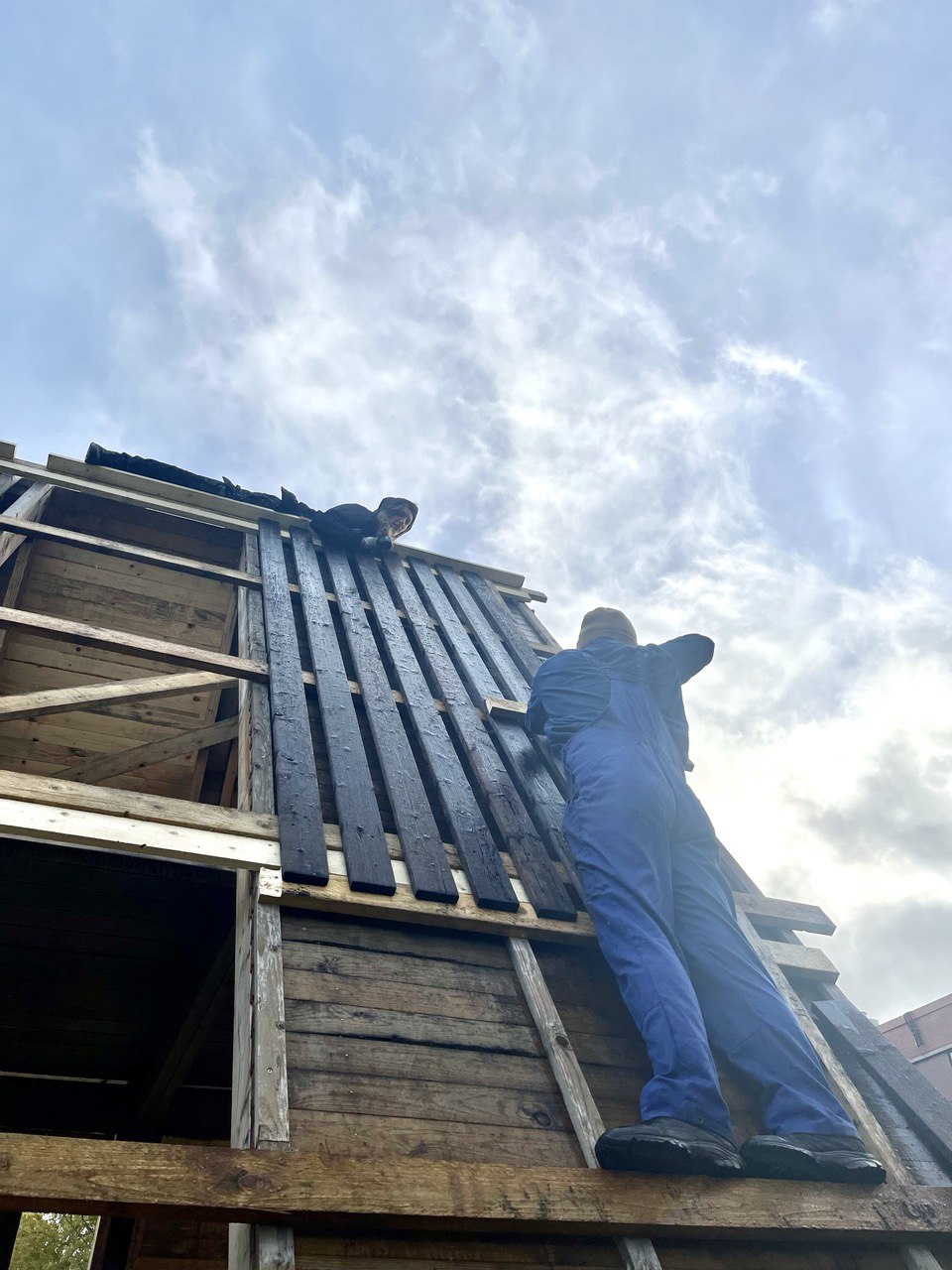 Charred wood for communal building project in action
