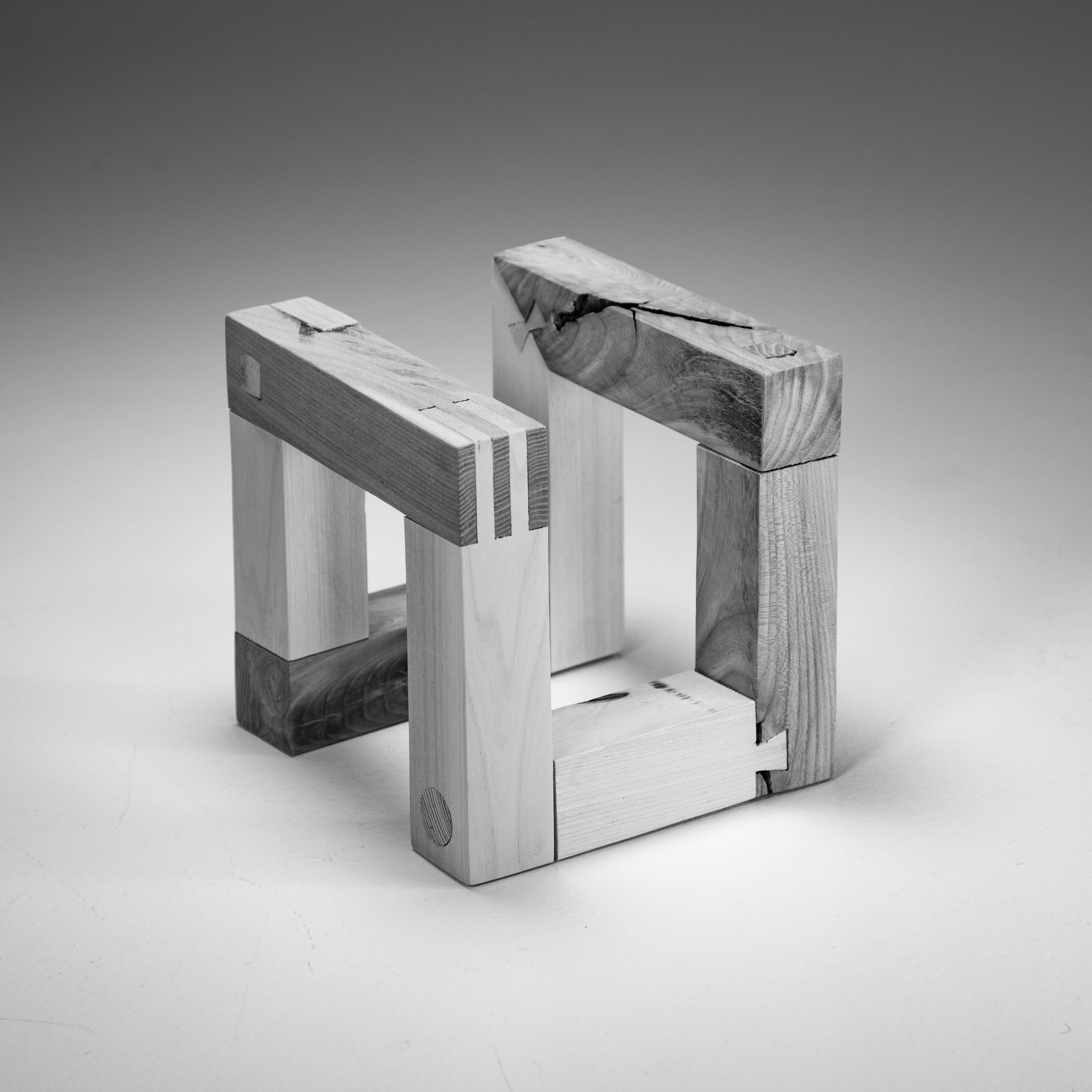 cube consisting of different species of wood joined together with different joining methods
