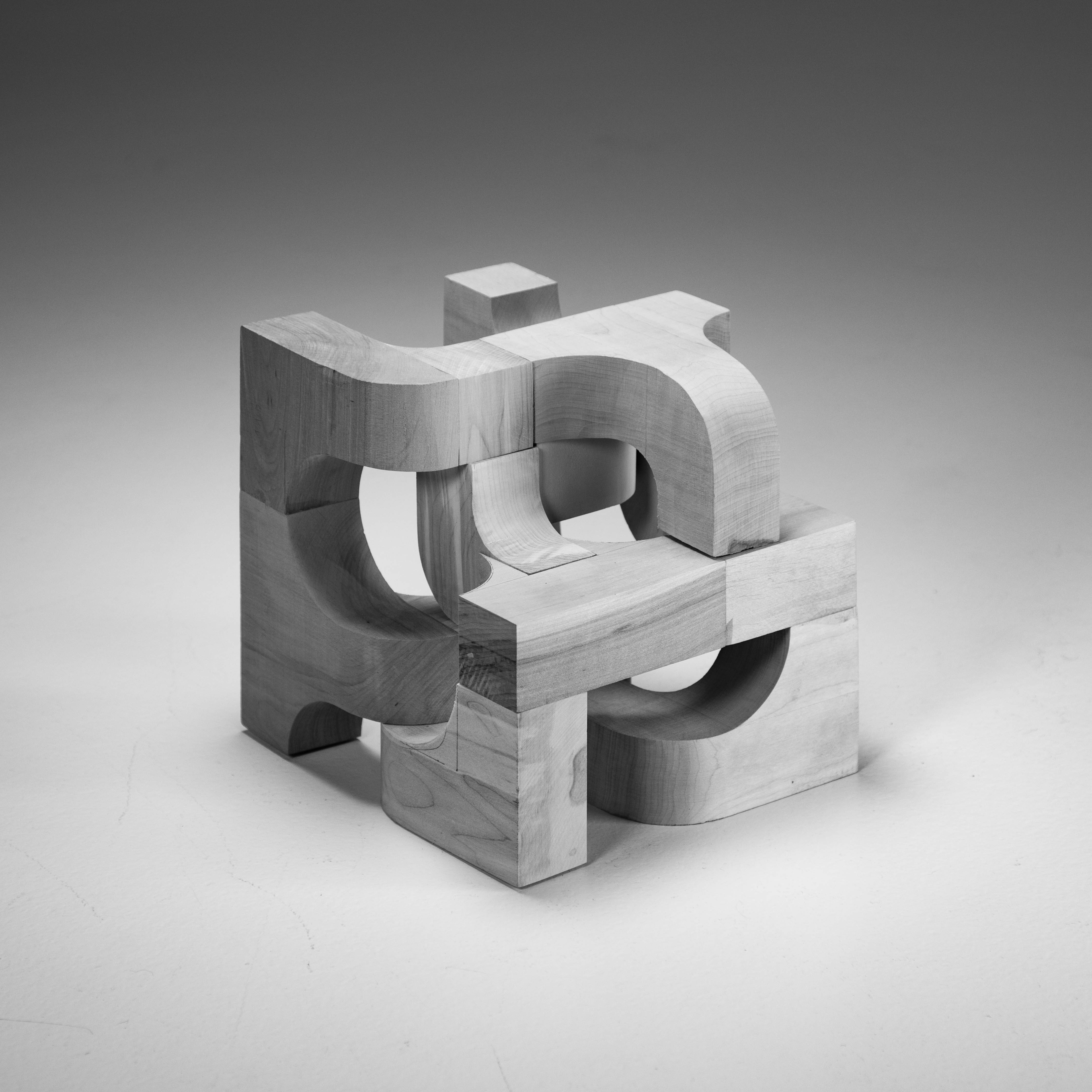 Wood cube made by rounding pieces and joining together to create a graphic outcome