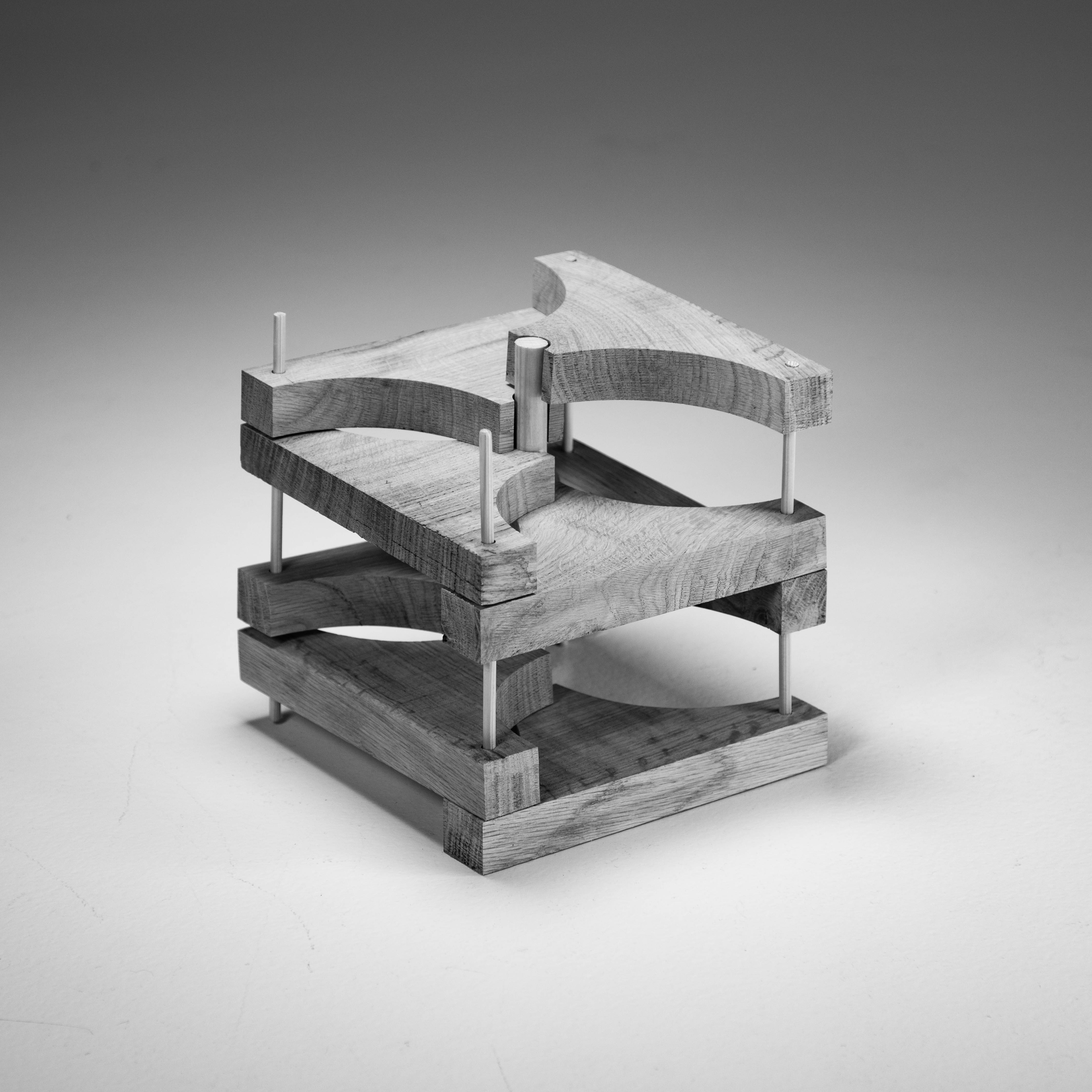 wood sculpture consisting of different layers that are interlocked with wooden dowels