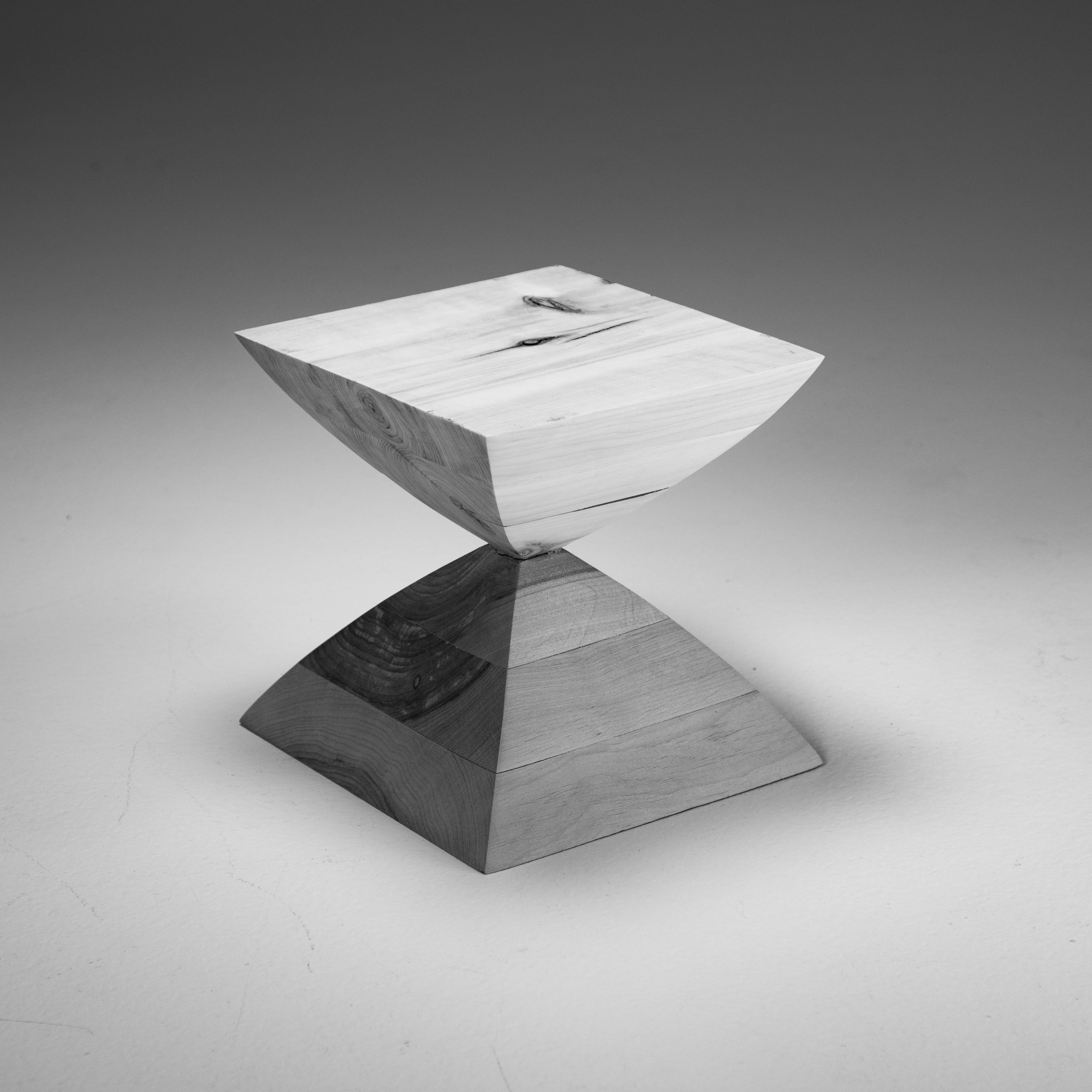 cube resembling an hourglass, of two different species