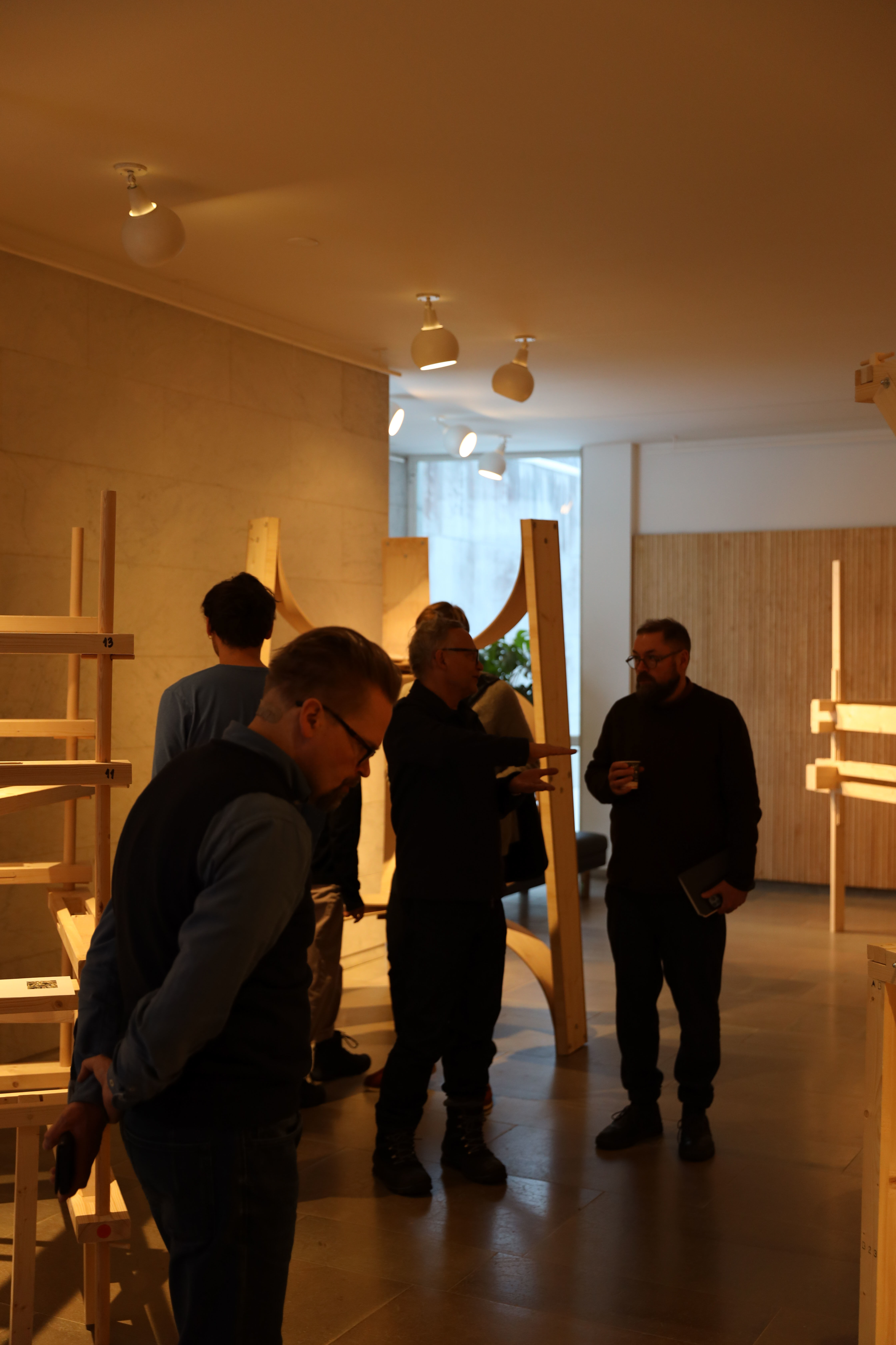 Visitors walking around and looking at the exhibition