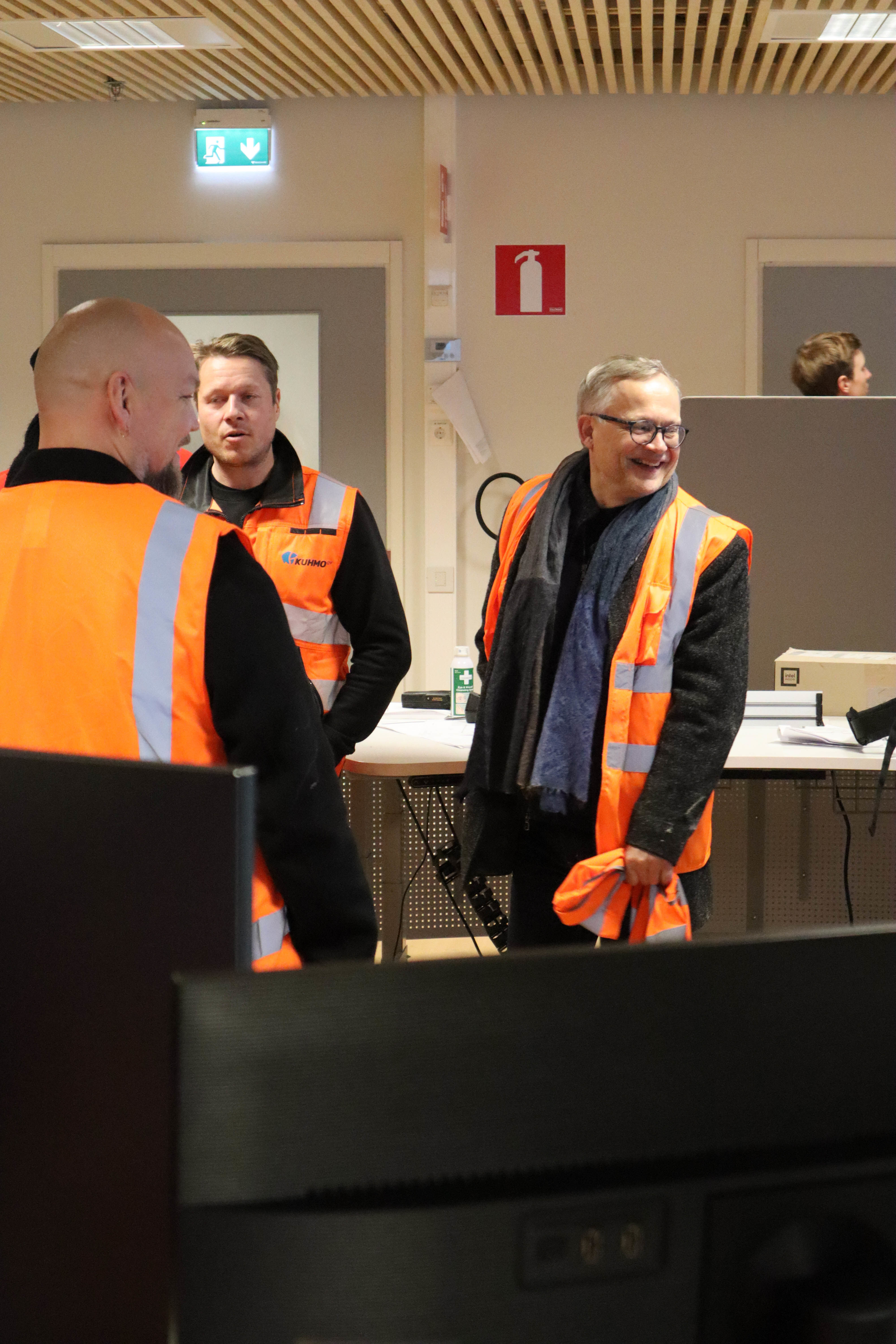 Teachers smiling in Kuhmo Oy control room