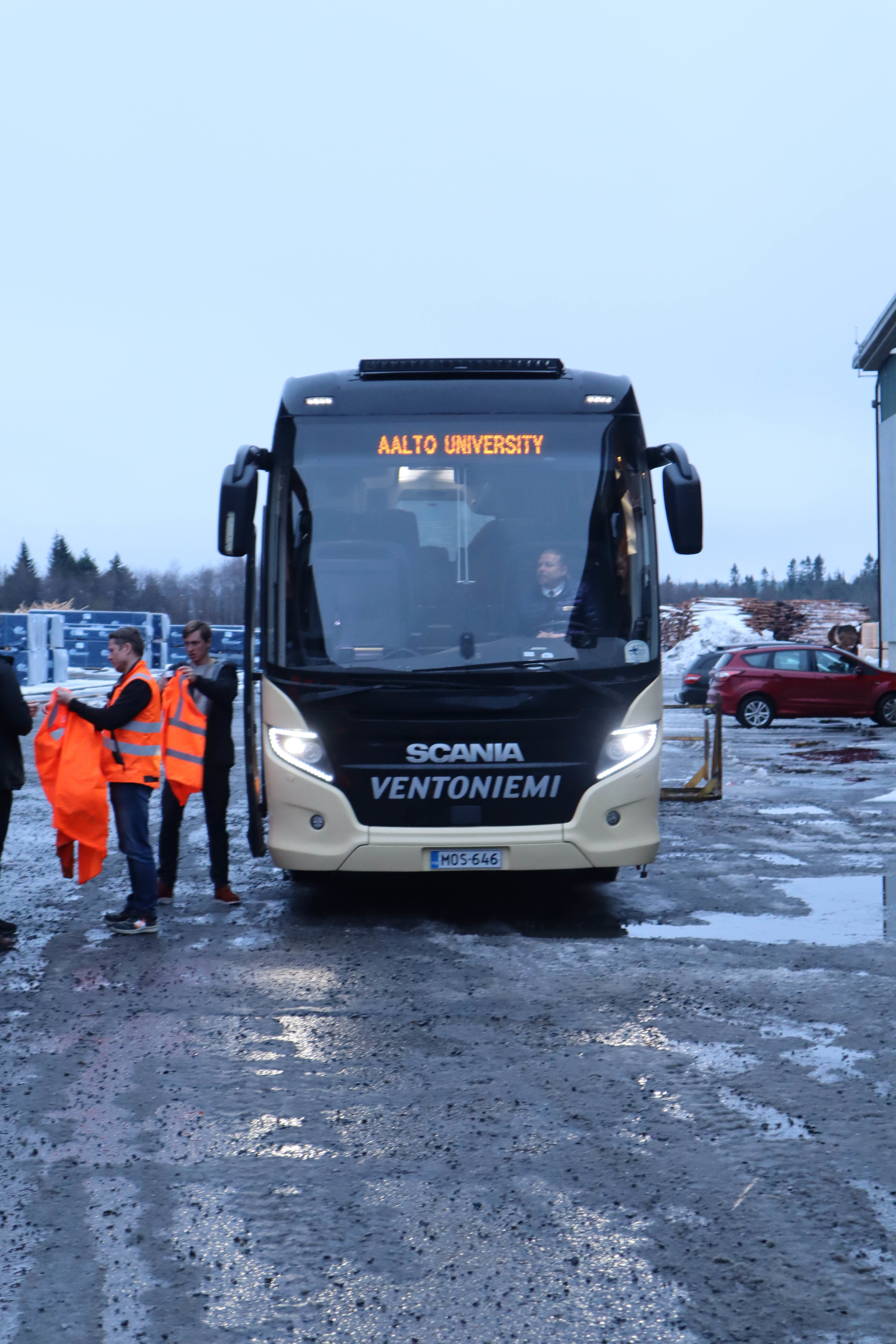 Large bus with LED letters showing words 'Aalto University'