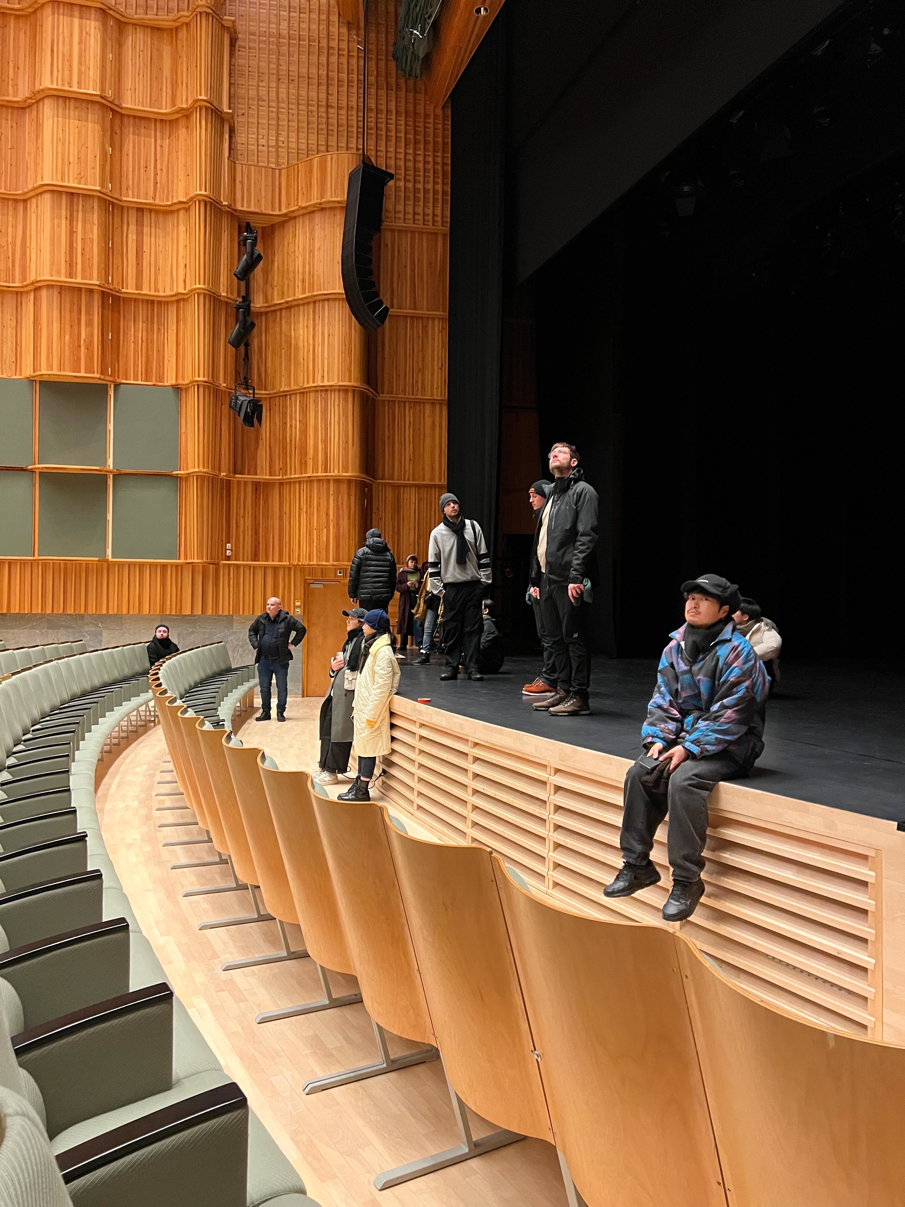Students on the stage of Kuhmotalo
