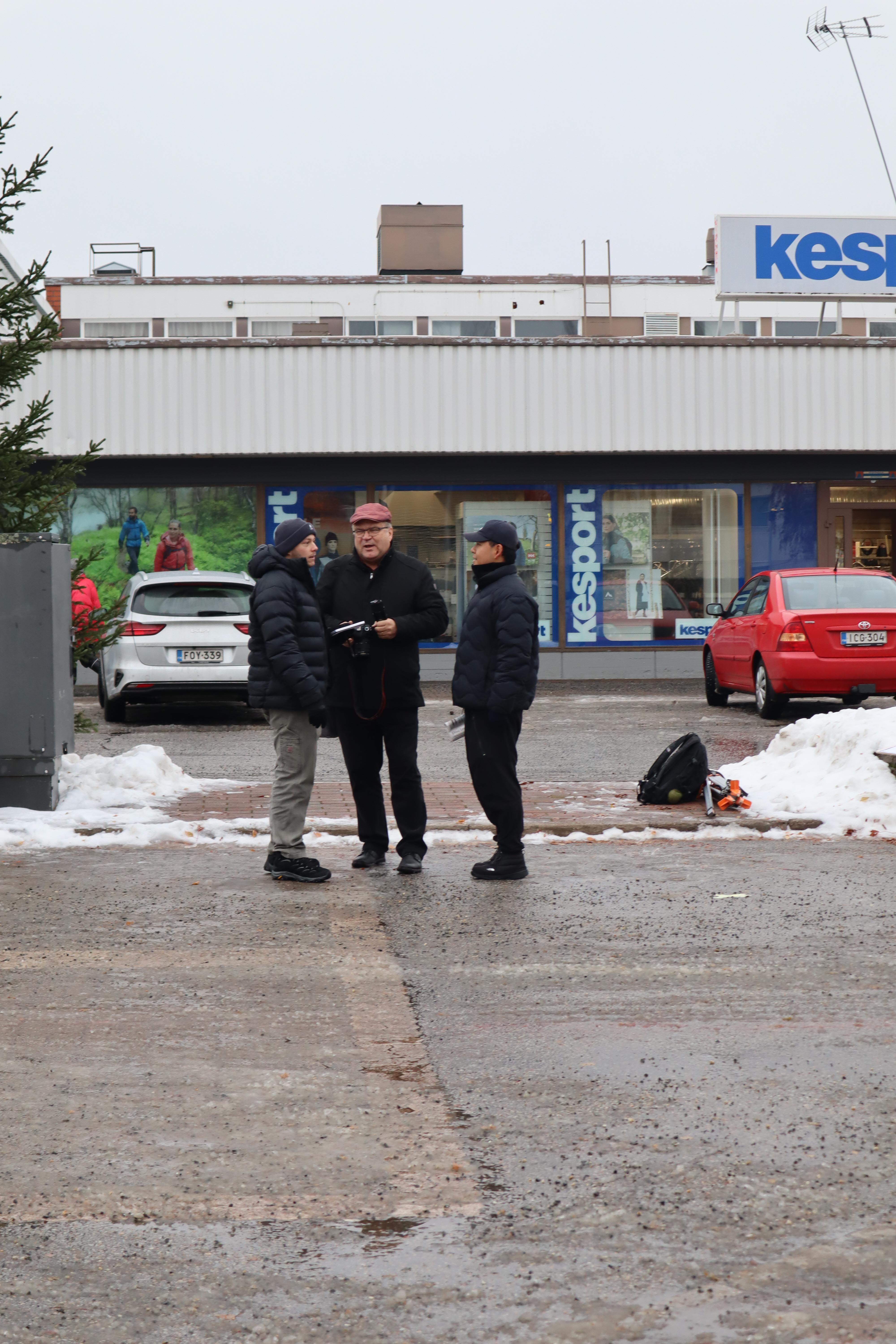 Students talking on site with local reporter