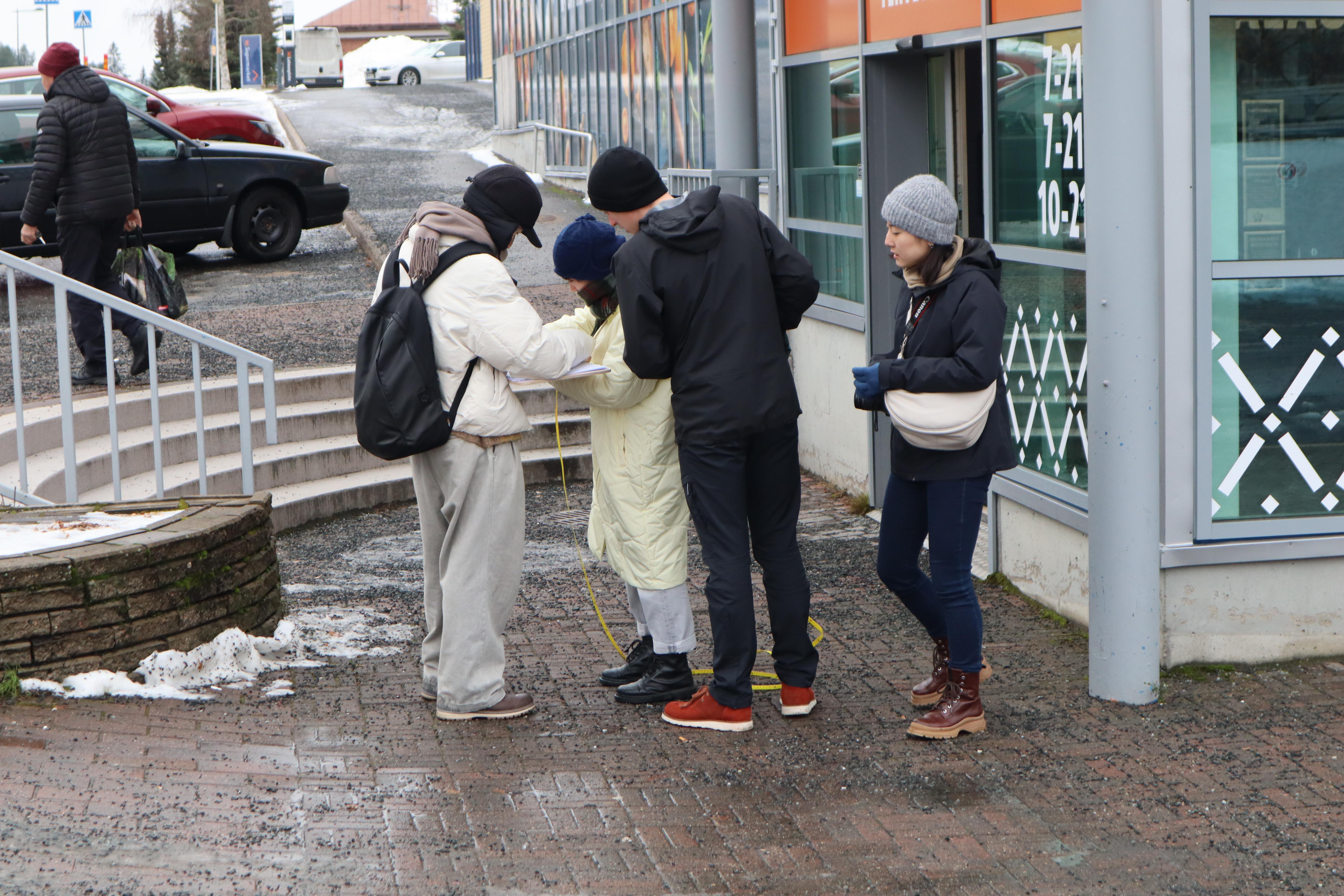 Students measuring the site