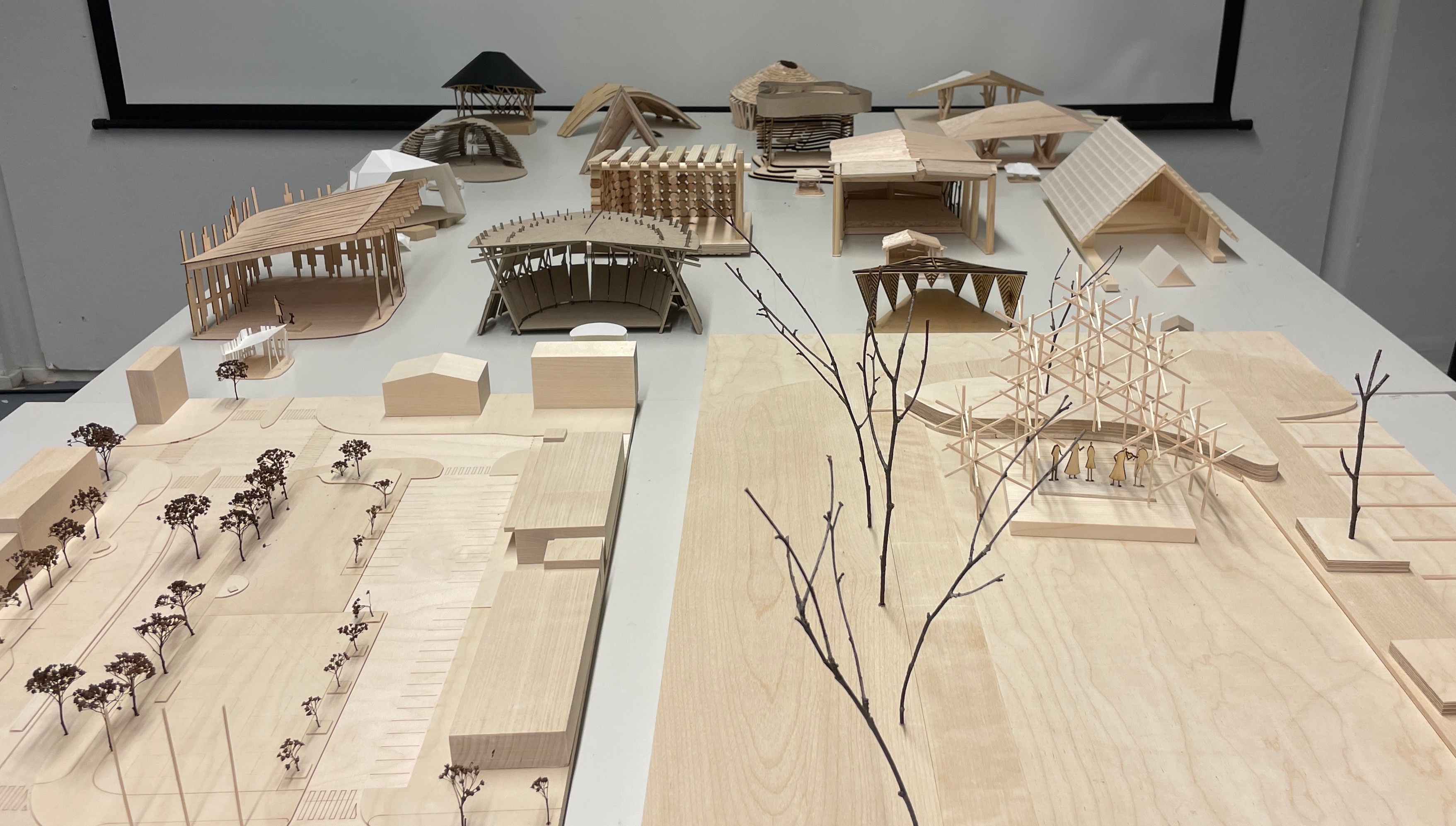 Photo of 1 to 50 scale models of all 17 proposals for the stage