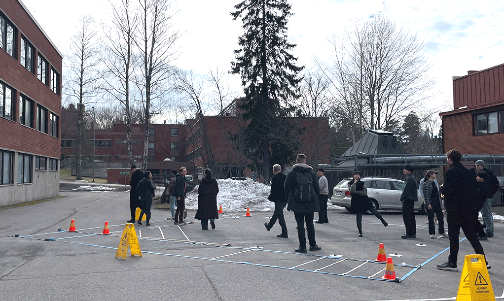 Moving image of students walking around the stage mockup and posing for camera