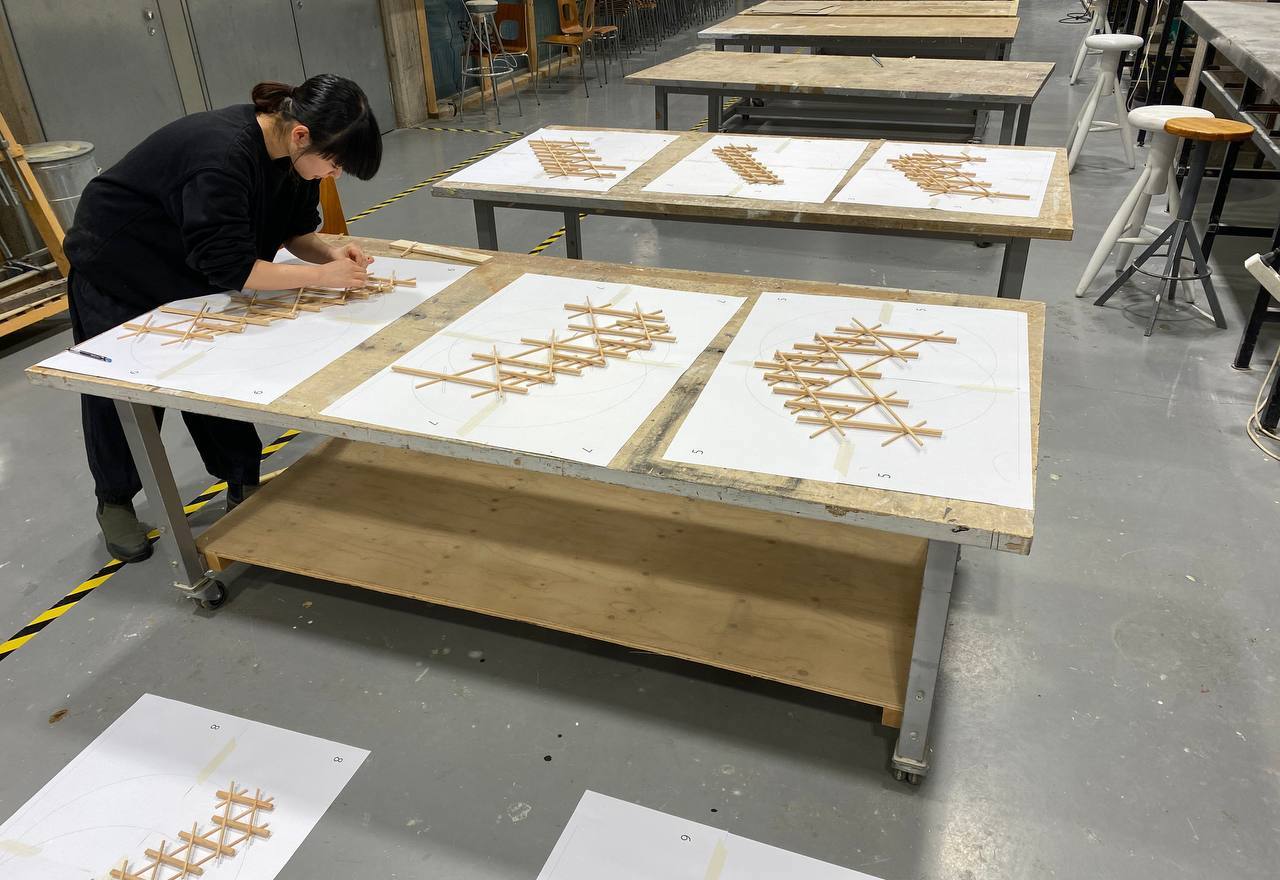 Student making scale model of the structure