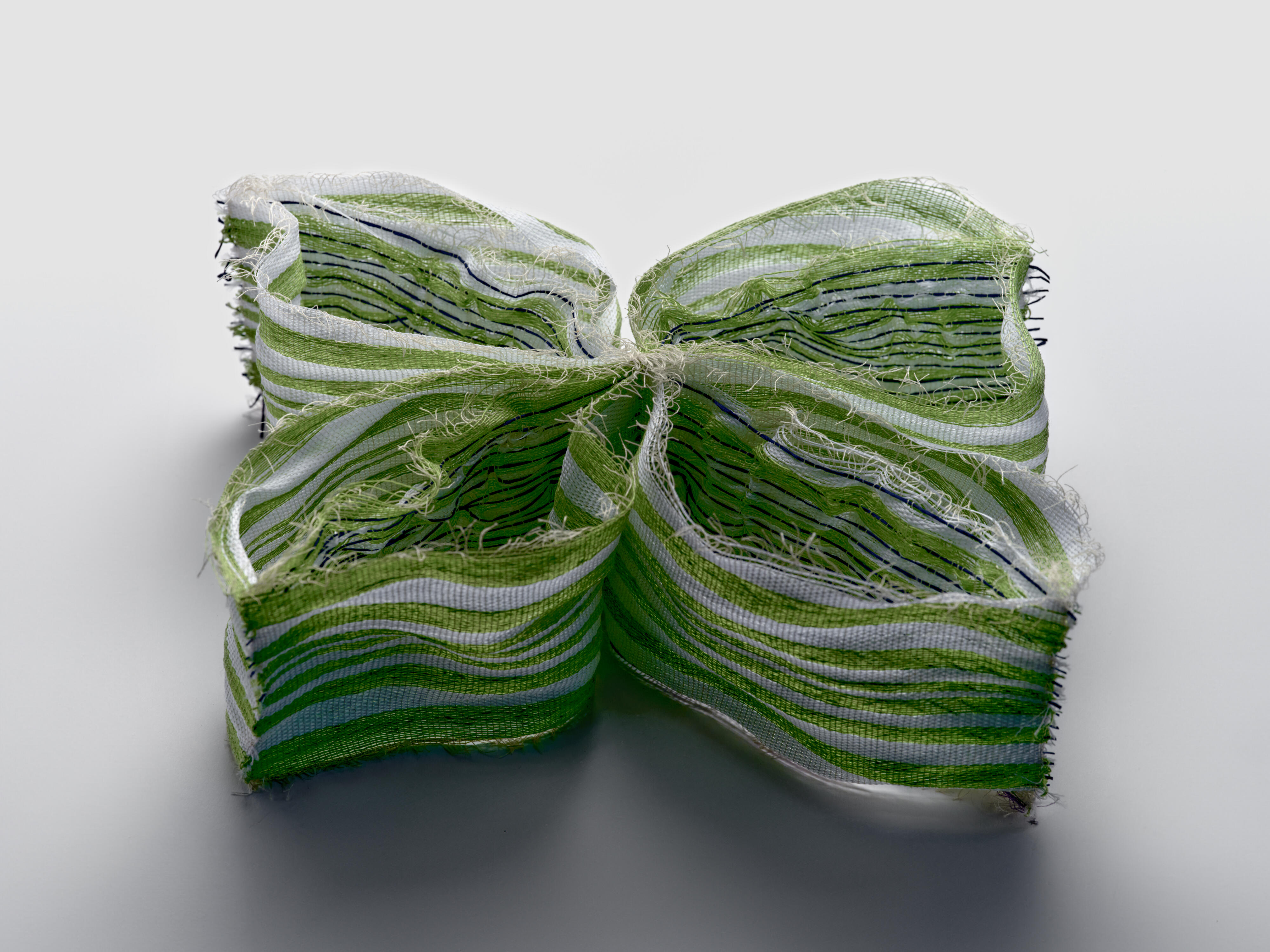A light-reactive textile sample part of Entangled exhibition in Designs for a Cooler Planet 2024.