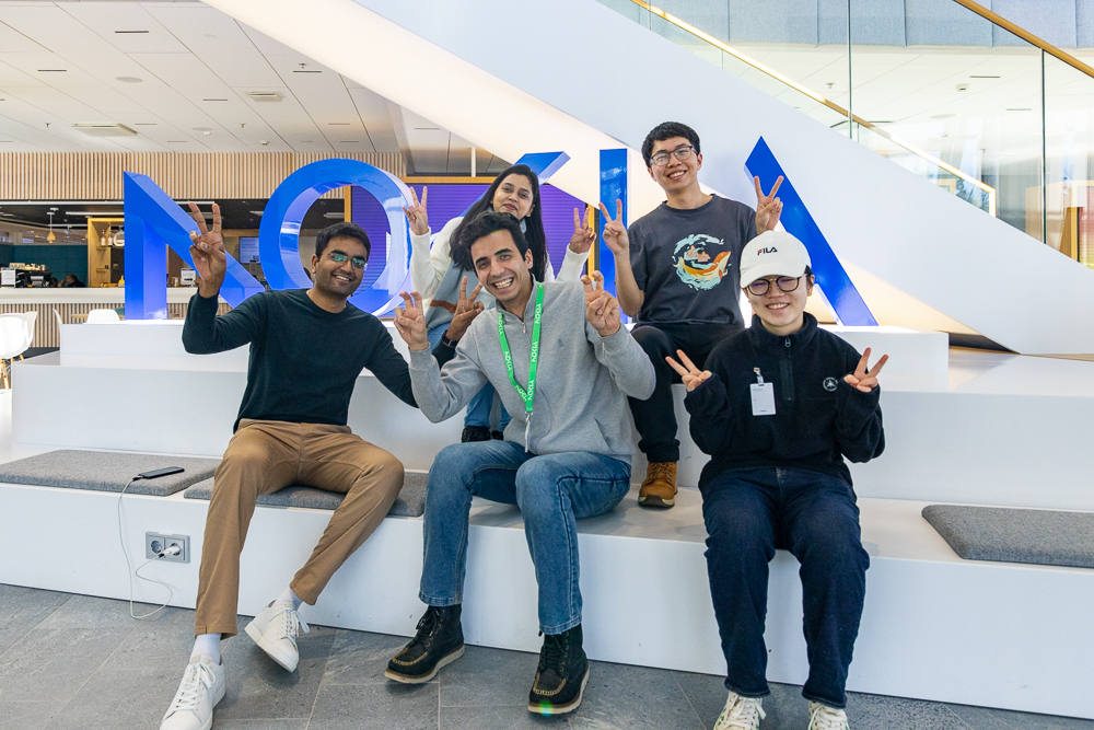 Group of students sitting on stairs.