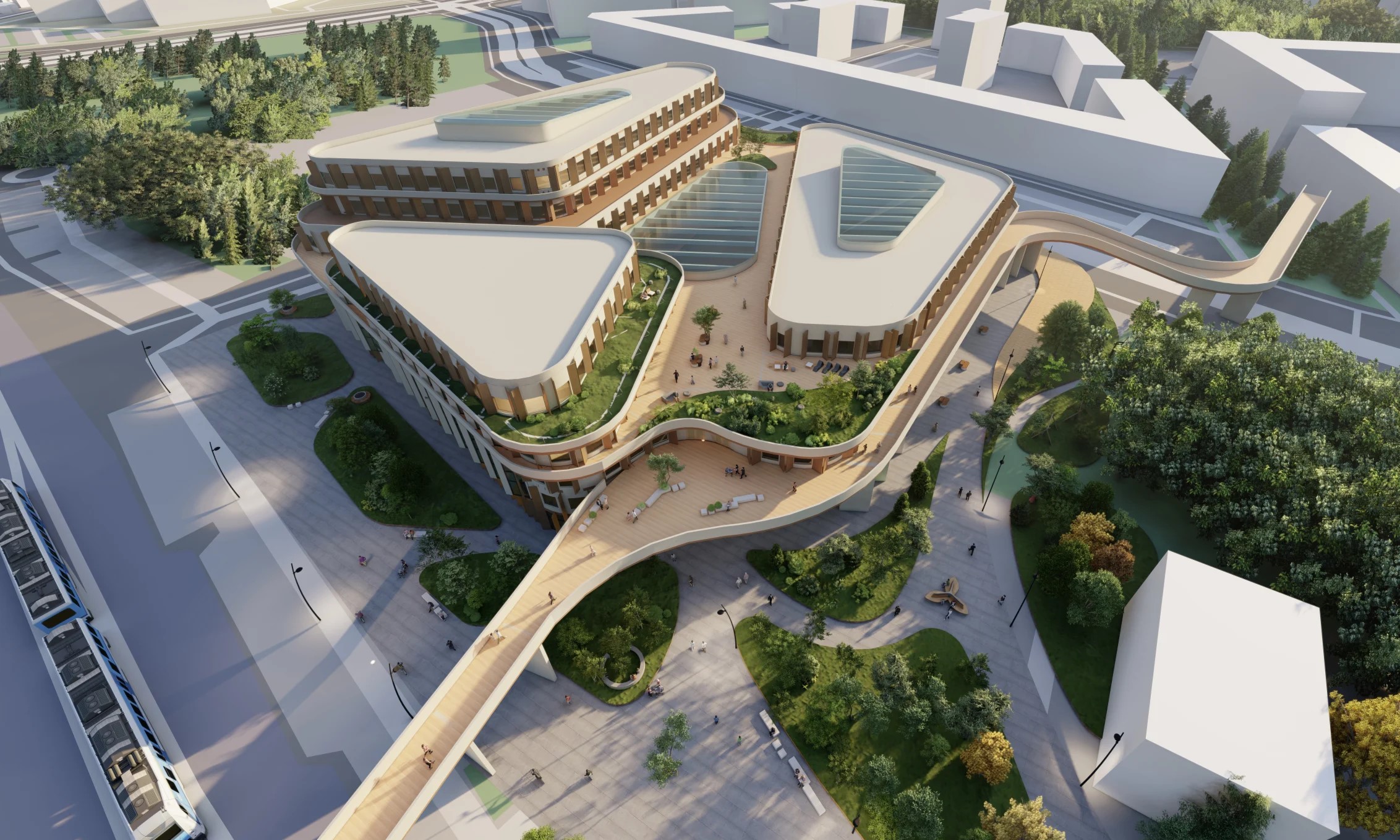 Aerial view of a modern building complex with green spaces, pathways, and a tram station nearby.