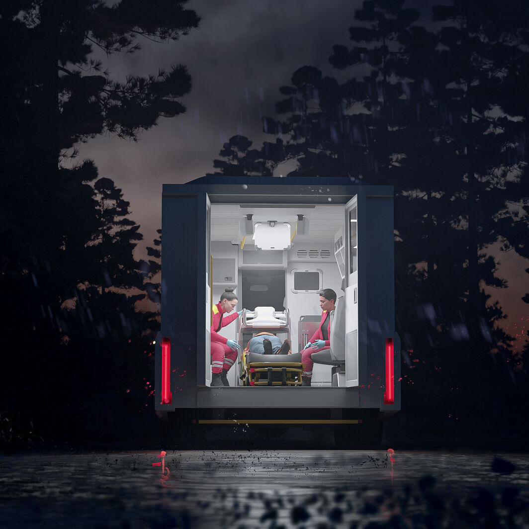 Paramedics treat a patient in an AMRI based Mobile Stroke Unit in a remote area at night