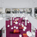 Harald Herlin Learning Centre, a view from the second floor to downstairs reading area. Photo by Aalto University / Tuomas Uusheimo