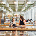 Two students at the Aalto University Learning Centre
