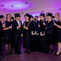 A group of doctors toasting at a Conferment party.