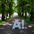 Aalto logo placed at campus on green pathway, photo by Mikko Raskinen 