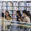 students and a book shelf
