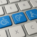 Keyboard with blue keys for wheelchair, hearing aid and white stick