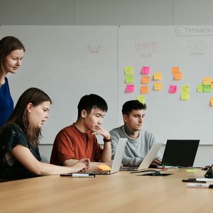 Students working together on laptops.