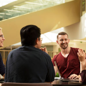 4 students sitting around table