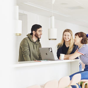 Three happy students. Photo: Unto Rautio