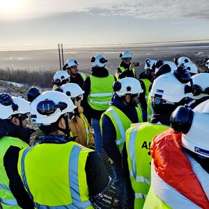 EMC students wearing helmets on a mining site
