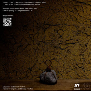 Poster for Kyoto craft workshop; cracked brown wall, grey stone tied with rope on a wooden surface