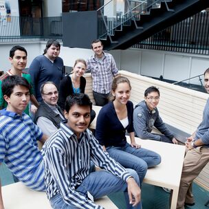 A group of people sat around a table