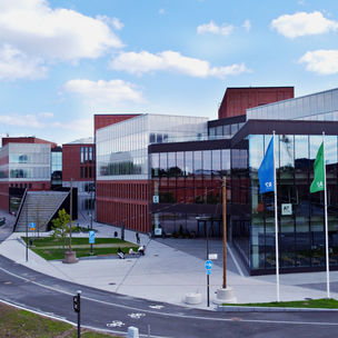 Picture of Aalto University School of Business building captured from outside in the spring.