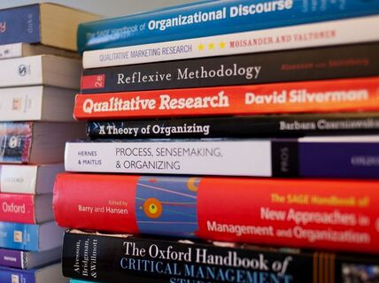 Stack of management books.