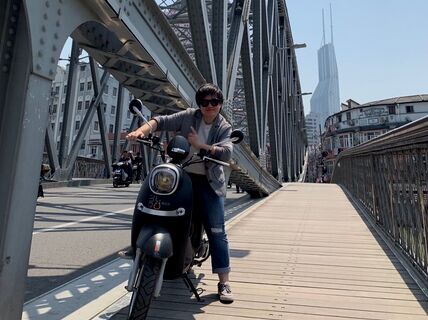 School of Business alumni Li Xu on her motorbike in China.