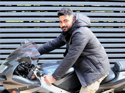 Aalto University / man sitting on a motorcycle / Muhammad Ziaur Rehman