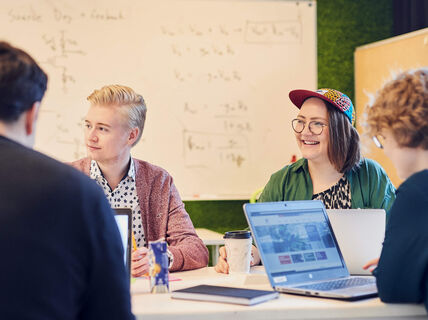 Students in front of whiteboard, photo by Unto Rautio / Aalto Material bank