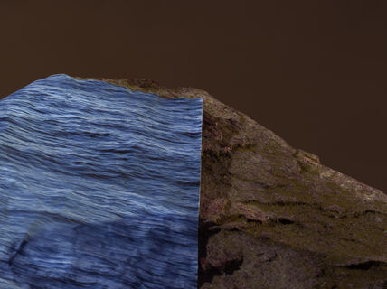 a blue colored print marking water has been placed on a rock to showcase the rising of water due to climate change 