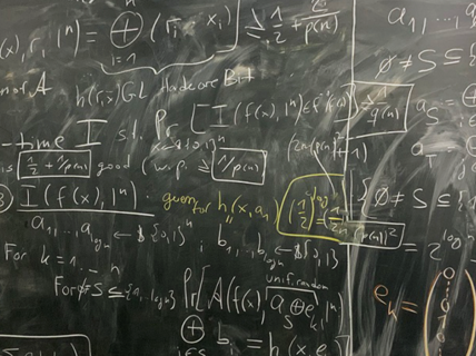 Blackboard filled with figures and equations