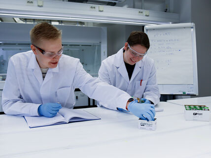 Jani and Sauli working on a group project smiling in the laboratory