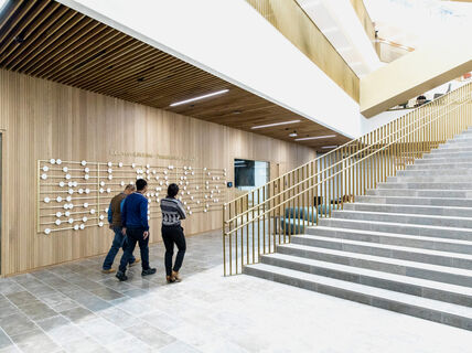 People and public artwork Donors' Wall at the School of Business. 