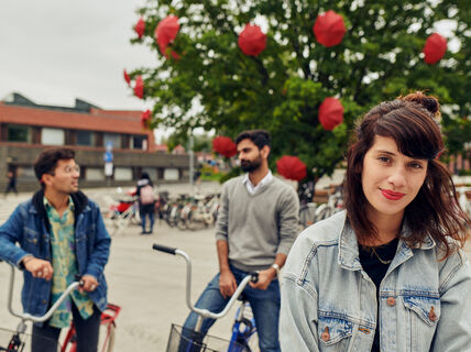 Three people dicussing casually