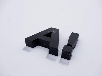 Aalto University logo A with exclamation mark on white surface