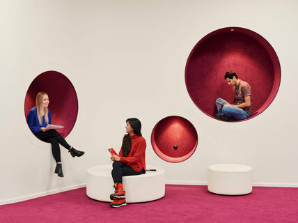 Students sitting and talking in the library