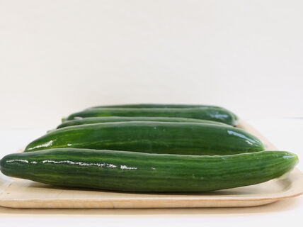 cucumbers on a plate covered with biobased liquid
