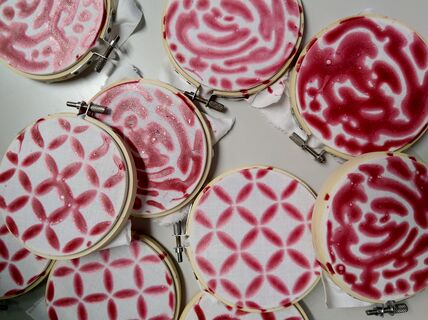 Red recycled cellulose used as a pattern on fabric