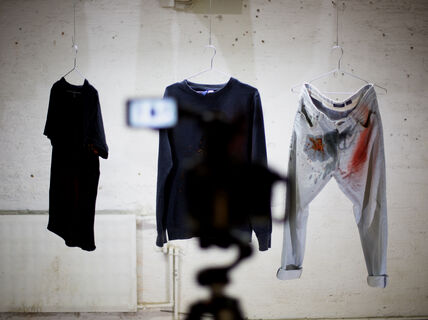 process photo of a video shoot where clothes are being tested